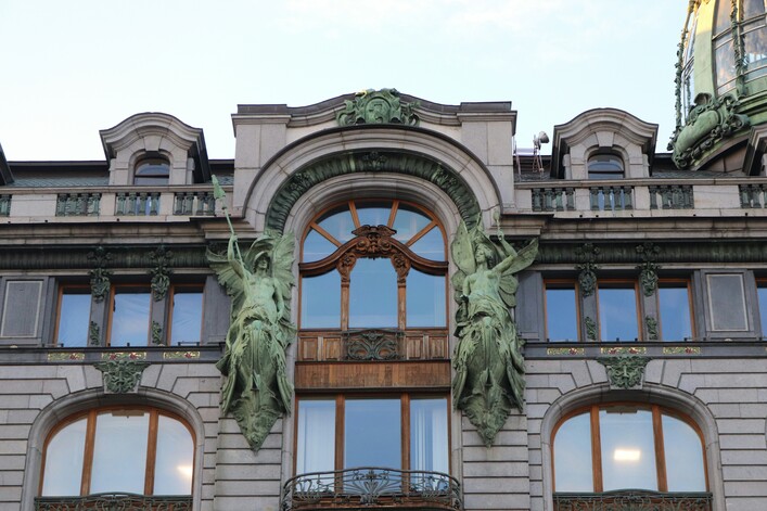 a large building with a clock on the top of it