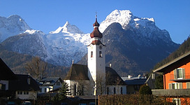 View on church in Lofer market town, Pinzgau region of Salzburg (state) in Austria. View to SW. Mountains: Großes Ochsenhorn 2513m, 's Kreuz 2466m, Breithorn 2413m, Anderlkopf 1475m