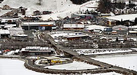 Ski resort Kaltenbach, Zillertal, Tyrol. Start of the cable car up to the skiing area with the Zillertal Straße (the main road), road access, parking lots and a multi-storey car park.