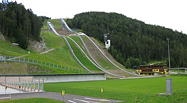 Toni Seelos Olympiaschanze ski jumping hills in Seefeld, Austria. The latest modernisation of the hills was done in 2010, when the biggest hill was enlarged from K90 (HS100) to K99 (HS109) and the smaller K68 (HS75) hill was built. Original description: The Ski Jumping Complex in Seefeld. Seefeld, Tirol, Austria, 2011.