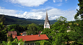 View from Rauth at Keutschach with steeple of the parish church in the municipality Keutschach am See, district Klagenfurt-Land, Carinthia, Austria