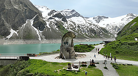 The Mooserboden reservoir in Kaprun with the monument in the foreground.