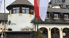 Entrance to the hotel with an Austrian flag.